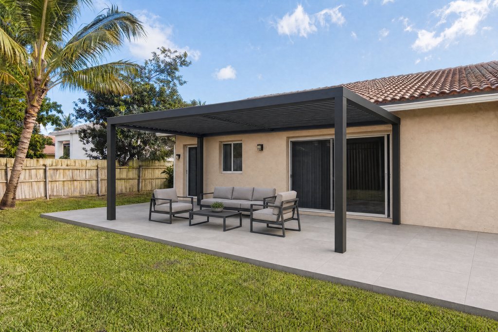 Black aluminum pergola over a new paver patio in a South Florida backyard (illustrative rendering)